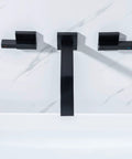 Front view of Matte Black Solid Brass Wall Mount Bathroom Faucet With Dual Lever Handles 8 Inch Center, installed on marble wall.