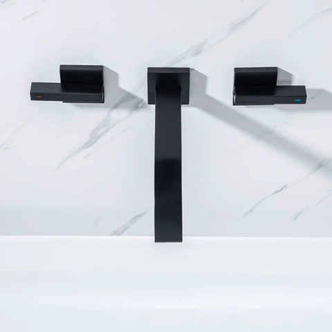 Front view of Matte Black Solid Brass Wall Mount Bathroom Faucet With Dual Lever Handles 8 Inch Center, installed on marble wall.