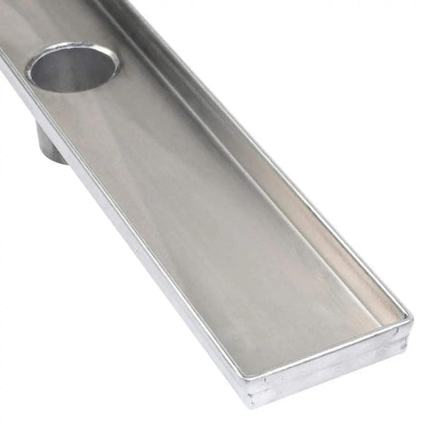 No Fuss 48 Inch Linear Shower Drain Grate With A Clean Square Hole Grid Built Tough Using 316 Marine Grade Stainless Steel close-up.