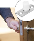 Heavy Duty Nylon Barn Door Rollers Rock Solid Floor Mounted Guide Bracket shown in hand with metallic plate for easy installation.