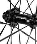 Carbon Disc Wheelset 50C Tubeless With Carbon Spokes Thru Axle Center Lock hub close-up; 12x100 front assembly detail.