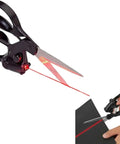 Laser-guided sewing scissors with black ergonomic handle; red laser guide beam on fabric