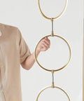 Antique Brass 74 Inch Industrial LED Floor Lamp With Arch Design Three Light Heads Energy Efficient Built In 3 Way Dimmer Perfect Dope Addition For Living Room Office Or Bedroom Decor close-up showing brass rings and structure