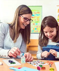 Child and adult crafting with Beginner Quilling Kit For Kids And Adults With Tools, Easy Step By Step Instructions visible on table.