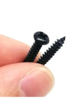 Heavy Duty Black Steel Micro Phillips Wood Screws Round Pan Head Self Tapping Hardware Kit in hand with pointed and pan head screws.