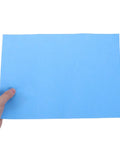 Colorful Carbon Tracing Paper Pack for Erasable Transfers on A4 Sheets, Perfect for Wood, Canvas, Embroidery and Crafts, Mess Free, Quick Copy, Ideal for Artists, Designers, and DIY Projects blue A4 sheet held by hand