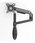 Slick Wall Mount Monitor Arm With Smooth Full Motion Articulation Premium Aluminum Mechanical Spring Display Stand Ergonomic Silver Laptop Workstation Ultra Heavy Duty side view of a black monitor arm on wall.