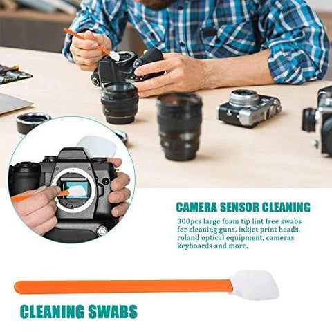 Wellgler's 5.11-inch foam cleaning swabs for cameras and lenses, 50 pcs; hands cleaning a DSLR with orange foam-tip swab