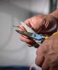 Using Free-Fall Snip, Scraper, And File With Serrated Blades For Easy Wire, Cable, And Cordage Cuts, Strips 19 AWG And 23 AWG Wire