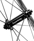 Close-up of Carbon Wheelset 700C Tubeless Road Wheels With Wave Rim 45mm 50mm Depth, V Brake Compatible hub