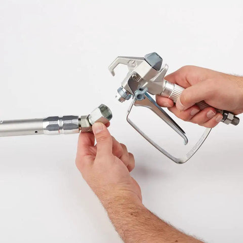 Connecting a spray gun to an extension for the Pressure Roller Kit For Airless Spray Guns No Tool Attachment With EvenFlow Drip Free Paint Delivery.