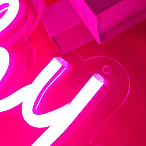 Close-up of Pink Happy Birthday Neon Sign With Dimmer For Party Decoration And Bedroom Wall Decor Two Panel 16.5x8 And 23x8 Inches Flexible Mounting