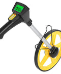 Rock Solid Digital Measuring Wheel with Telescopic Handle and Kick Ass Non Slip Rubber Roller for Pro Surveys or Nifty Home DIY Tasks Metric Inch Switch Top Shelf, close-up of yellow wheel and digital display.