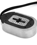 Top view of electric trailer brake magnet kit; oval metal housing with black pad and braided cable