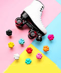 Two Pack Cat Paw Toe Stops For Quad Roller Skates 82A Rubber Brake Blocks with colorful paw shapes surrounding a white skate