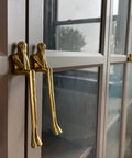 Dope Abstract Figurine Brass Cabinet Handles Set For Wardrobe And Cupboard Gold Finish Decorative Drawer Pulls installed on cabinet