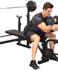 Home Gym Dumbbell Bench Station With Versatile Press Bench, Barbell Rack, And Squat Stand for core workouts, man using dumbbells