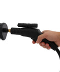 Hand holding a black steam cleaner attachment with bristles, designed for heavy duty cleaning with 1700W steam power.