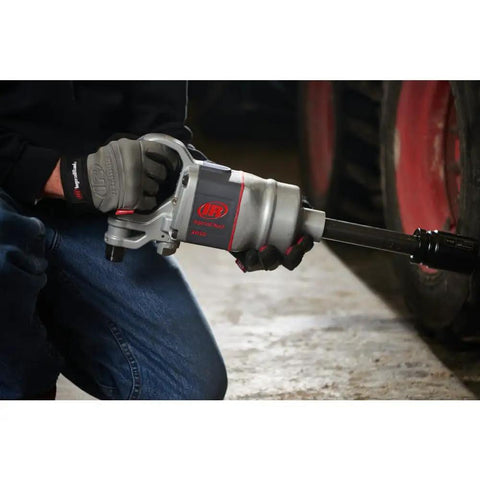 Pro Level One Inch Drive Air Impact Wrench Crafted For Boss Garage Tasks pumping out serious reverse torque, held by a mechanic.