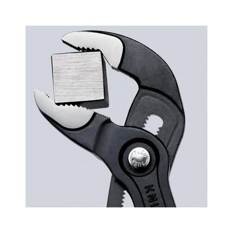 Cobra Water Pump Pliers 10 Inch With Self Locking Grip Quick Touch Button Adjustment gripping a metal nut