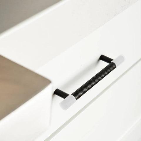Silicone Round Corner Protectors For Wardrobe And Drawer Handles in white on black drawer handles, soft touch, kid safe