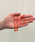 Kids Calmer Ear Plugs Alternative For Daily Noise Relief No Muffling Soft Silicone Reusable Ear Plugs in hand