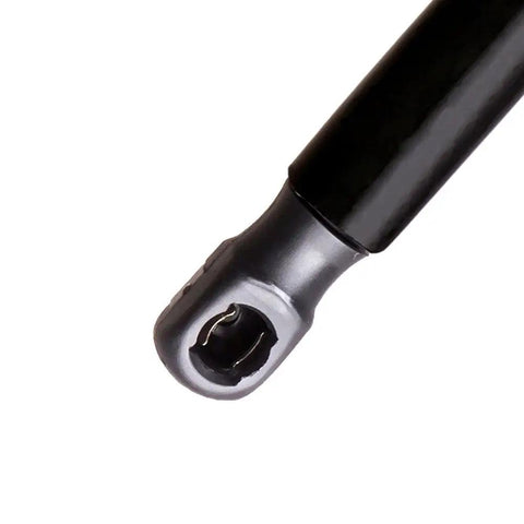 Close-up of a black Beefy Trunk Lift Support Gas Strut For Volkswagen Jetta 2011-2018 with metal attachment.