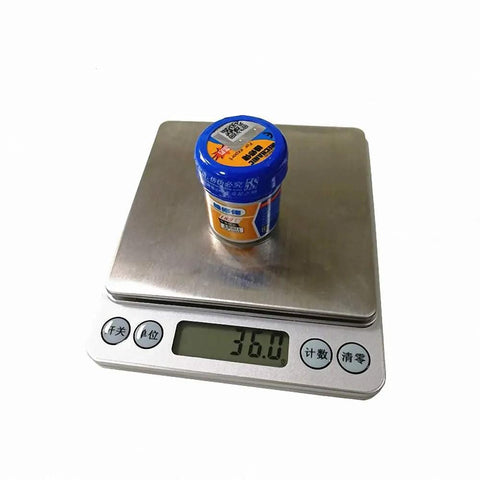 Pro Grade Mechanic Solder Paste XG-50 Sn63 Pb37 Flux For Mobile Phone PCB Repair Solder on digital scale showing 36.0g