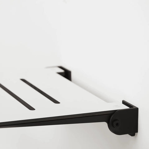 Close-up of 18 Inch SlimLine Folding Wall Mount Shower Bench Seat With White Phenolic Seat And Matte Black Frame attached