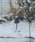 Heavy Duty Solar Hanging Enclosure For LoRa Nodes, secured under snow, black plastic shelter, outdoor winter setup.
