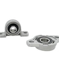 Thinking Process: vertical pillow block bearing, cast iron housing with chrome steel insert, front and angled view