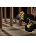 User holding Xtreme 12V Cordless Screwdriver with Brushless Motor, One Quarter Inch Quick Release Hex, ideal for home projects.