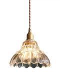 Clear Striped Glass Pendant Light Antique Brass Adjustable Mini Chandelier for Kitchen Island with glass shade and bronze cord.