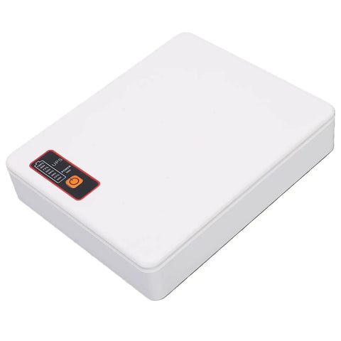 Compact Mini Ups Battery Backup For Home Routers Modems Offering 12000Mah Capacity And 18W Clean Output, white, rectangular design.