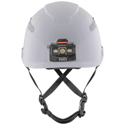 White vented safety helmet with rechargeable headlamp attached, designed for at-height and confined space work, front view.