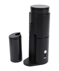 Top Shelf Portable Burr Coffee Grinder Featuring 38mm Stainless Steel Conical Blades And Anti Static Magnetic Cup, black handheld design.