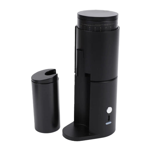 Top Shelf Portable Burr Coffee Grinder Featuring 38mm Stainless Steel Conical Blades And Anti Static Magnetic Cup, black handheld design.