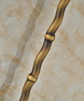UMJIGF 8 Inch Antique Shower System with Hot and Cold Water Shower Combo Set long, curved antique handle against marble background.