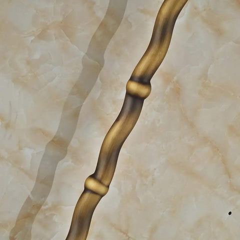 UMJIGF 8 Inch Antique Shower System with Hot and Cold Water Shower Combo Set long, curved antique handle against marble background.