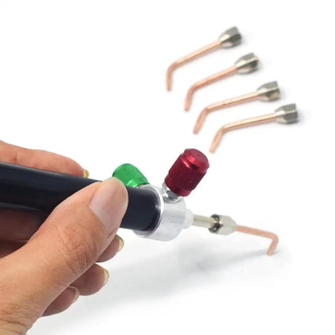 Mini Oxygen Torch Kit with Five Precision Nozzles held in hand, designed for jewelry repair and micro welding work.
