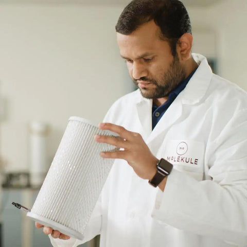 Scientist examining PECO Filter With Activated Carbon For Air Pro Purifier High Efficiency Replacement for air quality analysis.