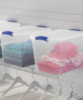 Heavy-Duty Clear Plastic Storage Bins With No-Fuss Blue Latches, 27 Qt Stackable Organizers For Wardrobe Clothes And Bulk Supplies, BPA Free And Built Tough To Handle Heavy Lifting, 2 Pack with colorful clothing inside.