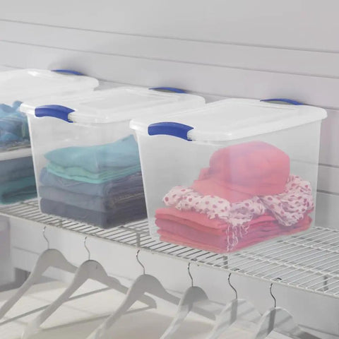 Heavy-Duty Clear Plastic Storage Bins With No-Fuss Blue Latches, 27 Qt Stackable Organizers For Wardrobe Clothes And Bulk Supplies, BPA Free And Built Tough To Handle Heavy Lifting, 2 Pack with colorful clothing inside.