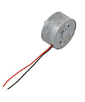 High Output Dc Motor Running 1.5 To 6V Kicking Out A Clean 9000 Rpm inside a round metal casing with black and red wires.