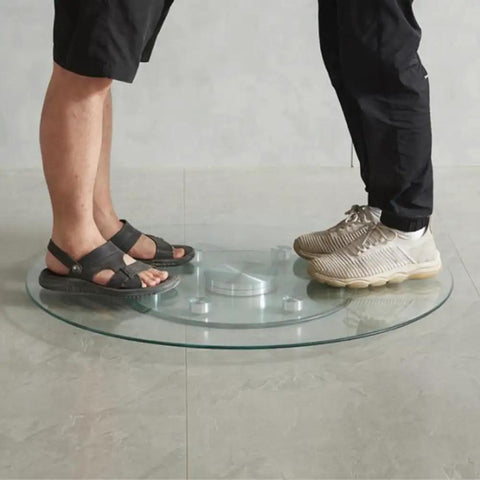 People standing on Tempered Glass Lazy Susan Turntable for Round Dining Tables, 360 Degree Rotating Serving Tray, demonstrating durability.