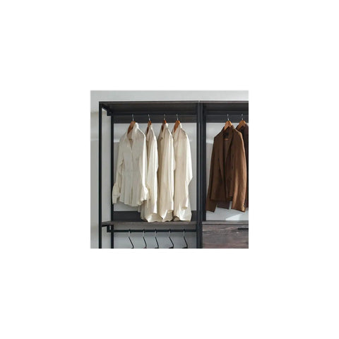 Customizable Wood Walk In Closet Organizer System Featuring Reinforced Hanging Bars And Versatile Shelves To Level Up Your Master Bedroom Storage And Kick The Clutter To The Curb with hanging white shirts and brown jackets.