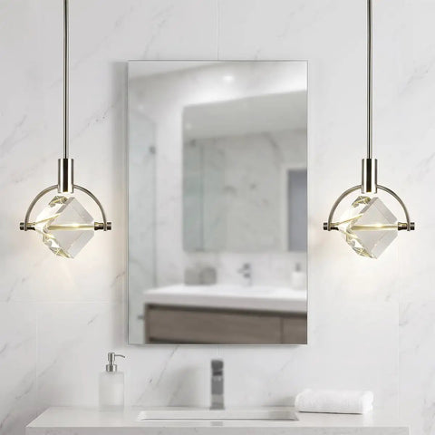 Lamparko Small Pendant Light Fixture with Crystal Cube, Brushed Nickel above a modern bathroom mirror.