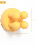 Yellow silicone hook from Four Pack Self Adhesive Silicone Toothbrush Holders Wall Mounted Mirror Hooks For Shower Bathroom Kitchen