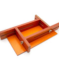 Adjustable Battery Spot Weld Jig For 18650 And 26650 Cells With Flexible Array Layout And Hella Tough High Density Bakelite Rig on orange base.