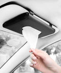 Sleek Genuine Leather Car Tissue Holder Sun Visor Napkin Dispenser Secure Clip Fits All Rigs in use with a tissue being pulled.
